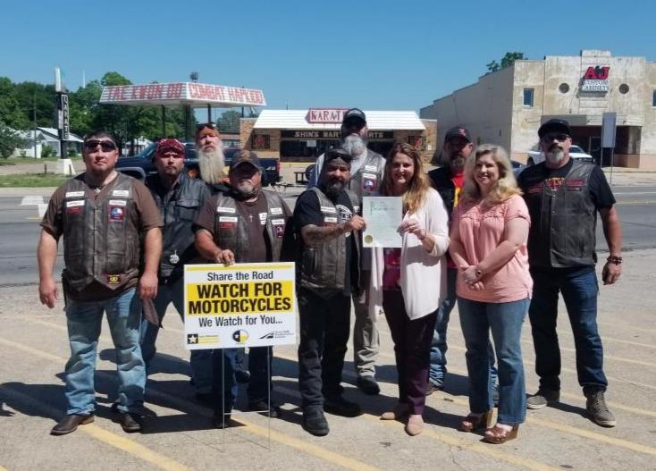 Group with Watch for Motorcycles Sign